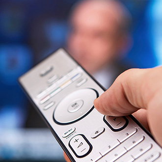 Remote control pointed at screen image